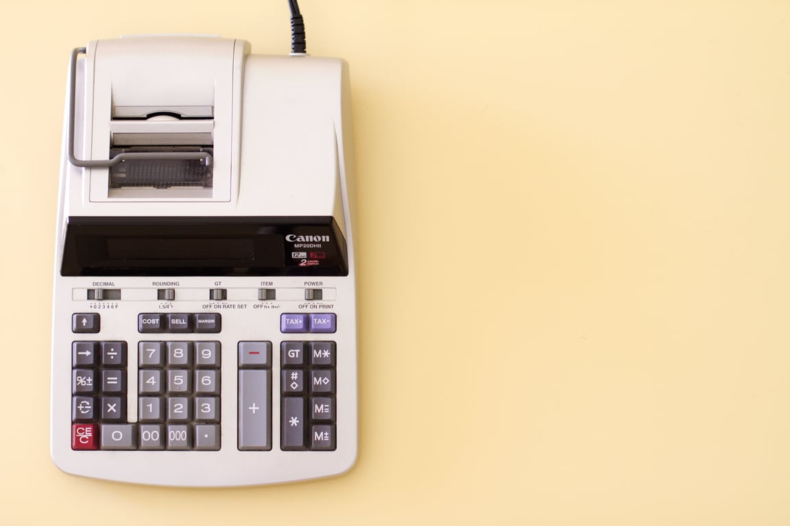 A large calculator on a table.